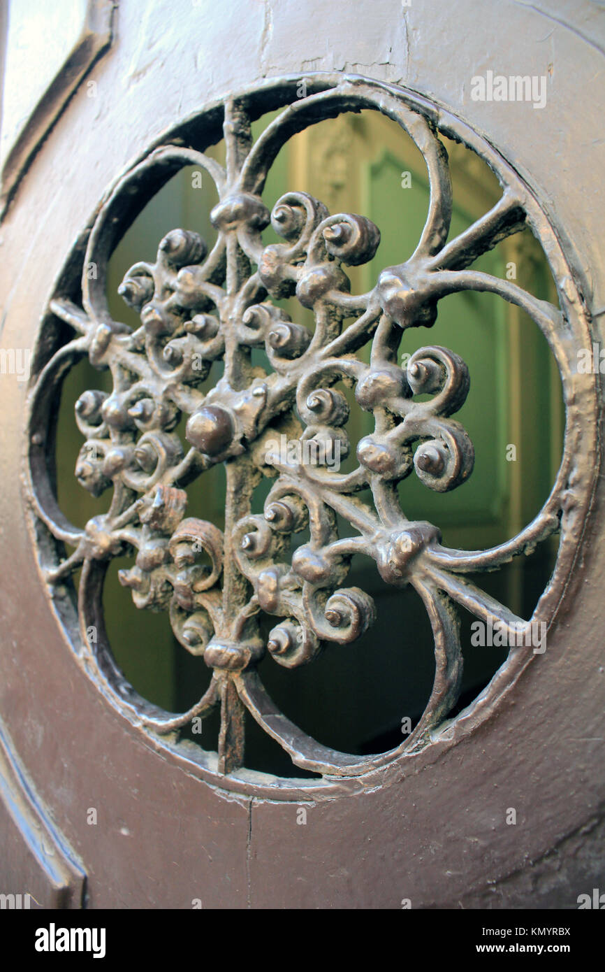Wrought Iron Porthole on Door Stock Photo