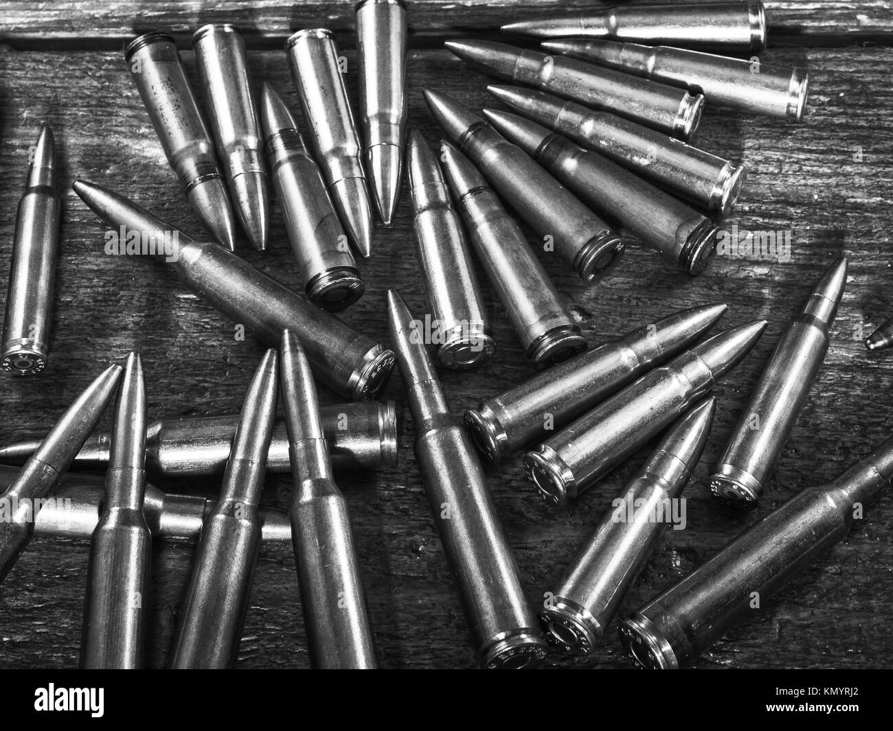 Many bullet on the wood. bullets of various calibers Stock Photo