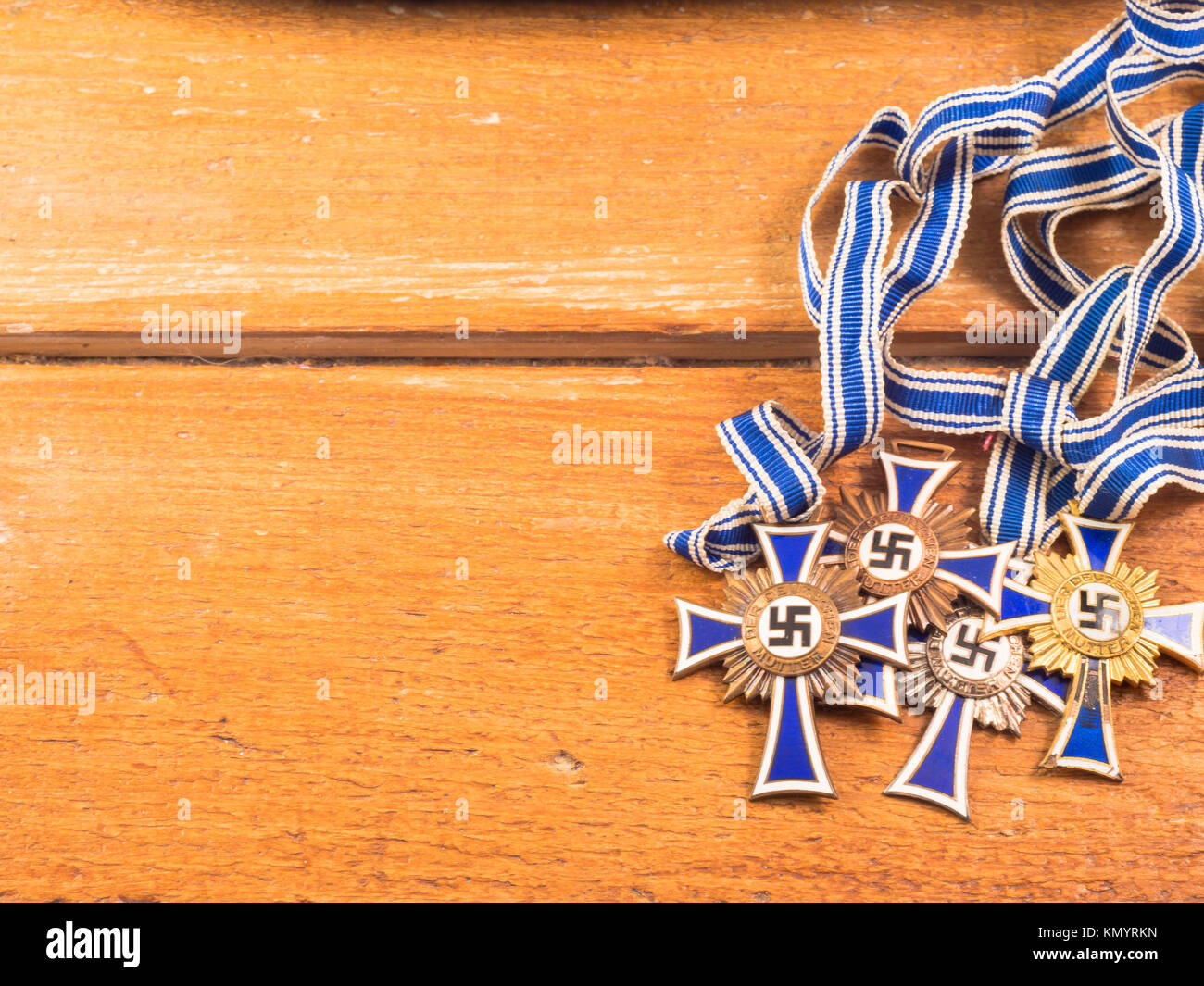 Nazi cross of honor for German mothers.  Gold silver and bronze based on the children made. material of historical interest, no apology of Nazism Stock Photo
