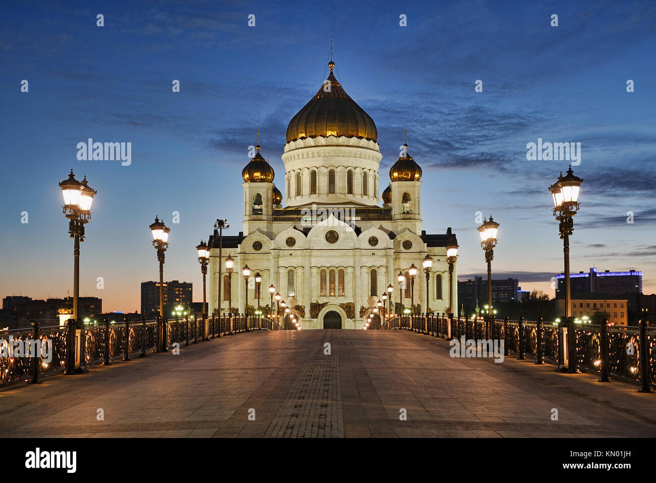 MOSCOW, RUSSIA - Patriarchy Bridge and Cathedral of Christ the Savior in Spring Twilight. Framed by street lights. Stock Photo