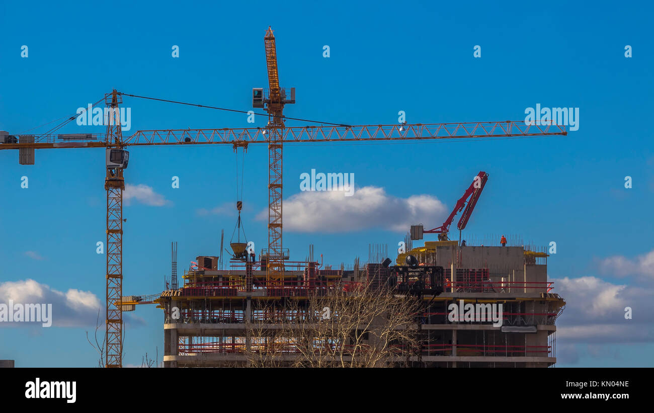 Cranes working on construction of the housing estate in former ...