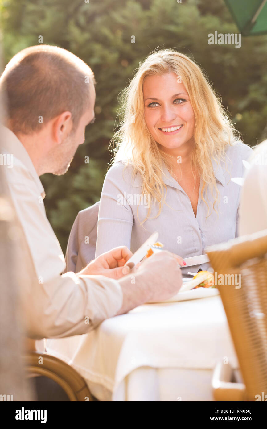 Businesspeople having lunch in restaurant Stock Photo