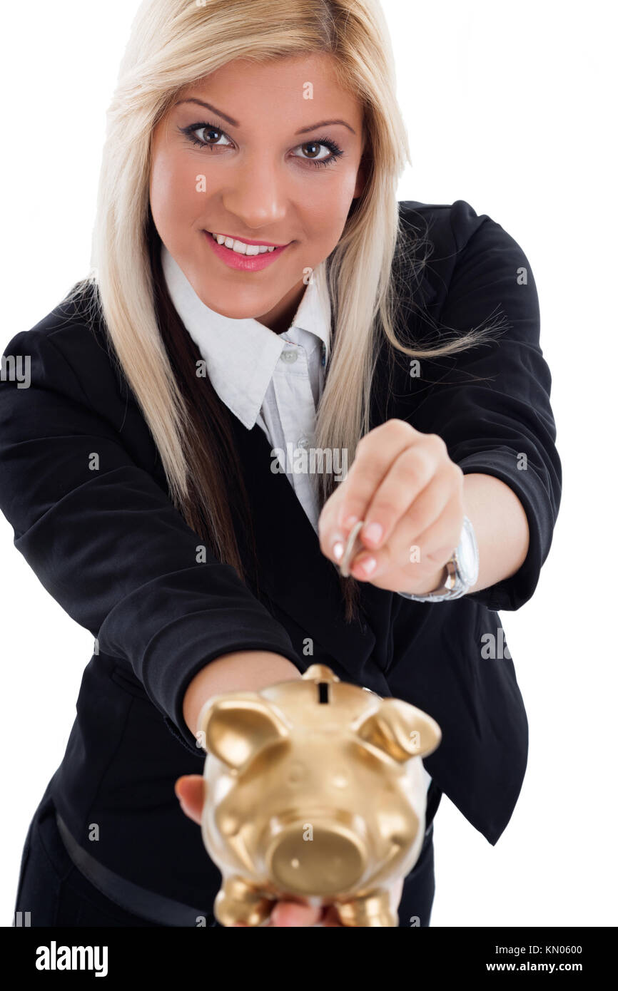 Beautiful young woman putting coin into piggy bank Stock Photo - Alamy