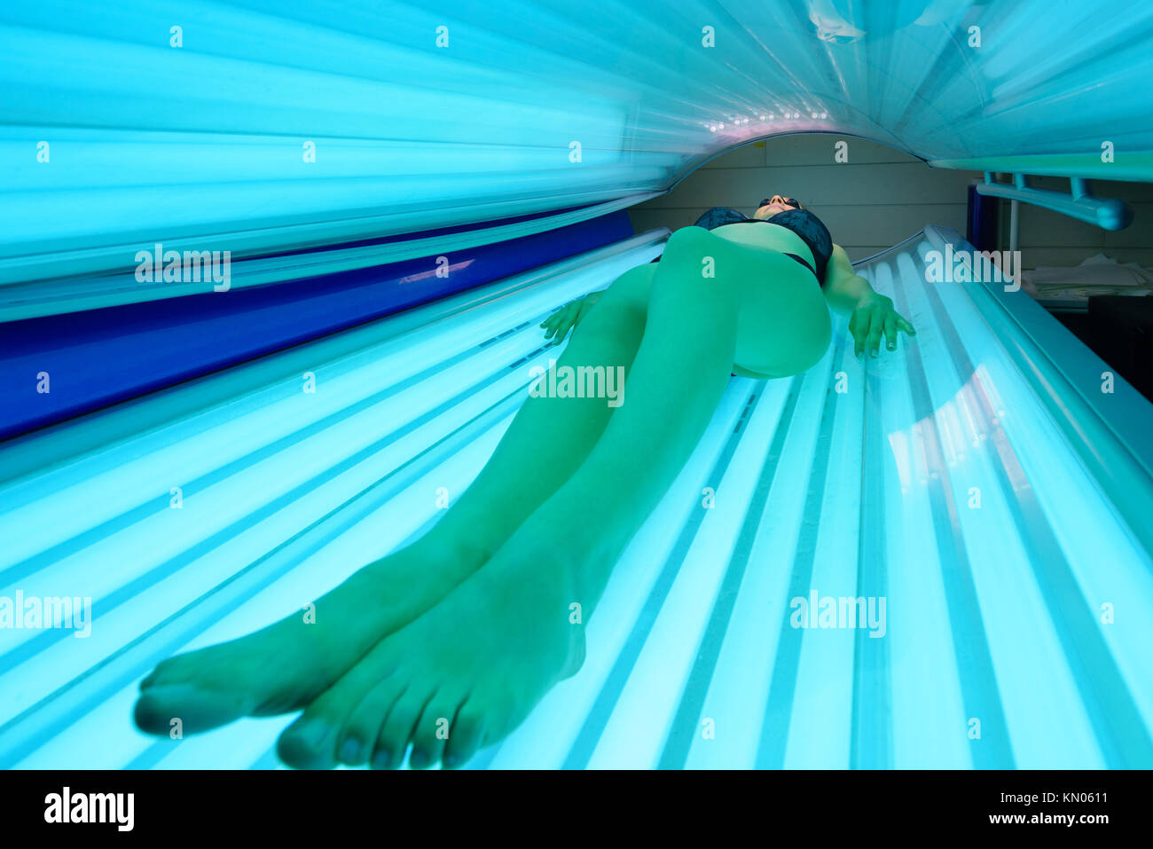 Woman layed on sun bed Stock Photo - Alamy