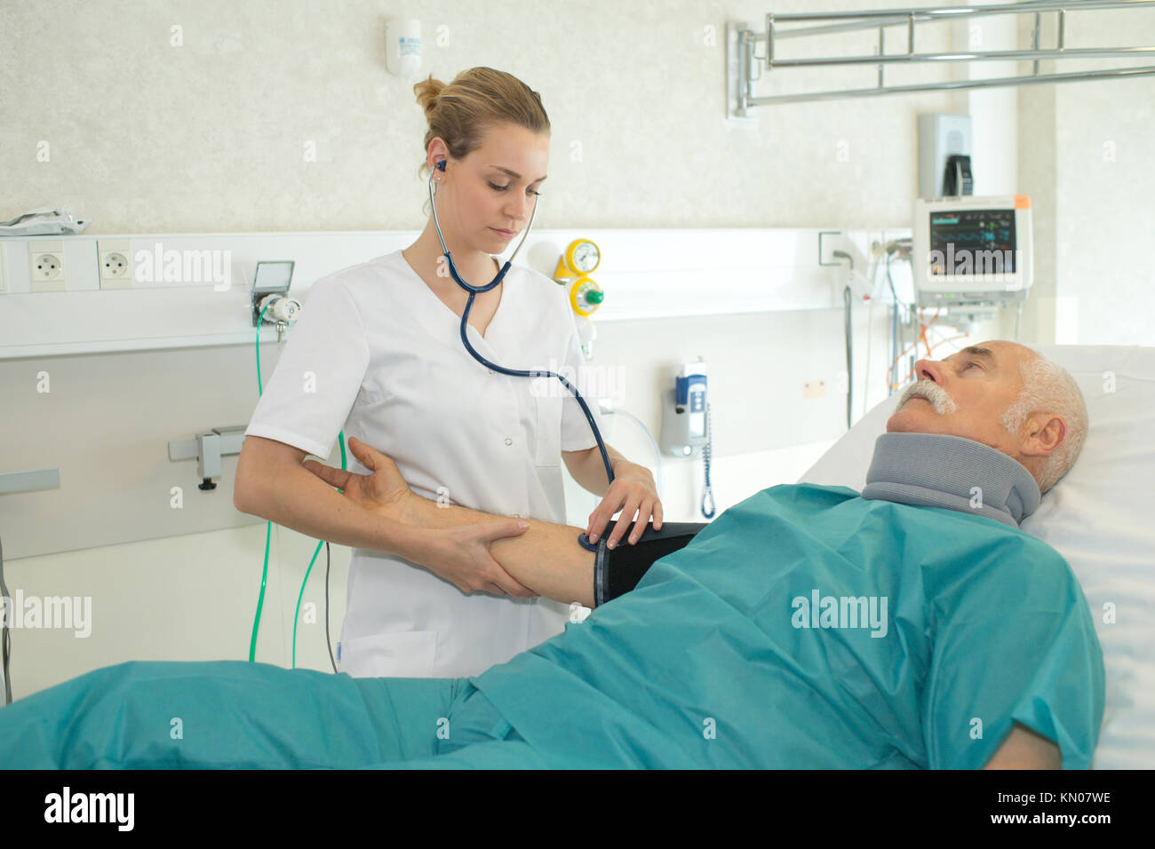 nurse doing a medical examination on senior patient Stock Photo Alamy