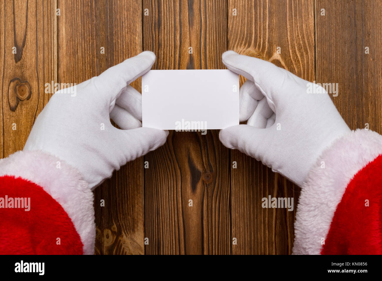 Santa Claus holding a white blank card good for test Stock Photo - Alamy