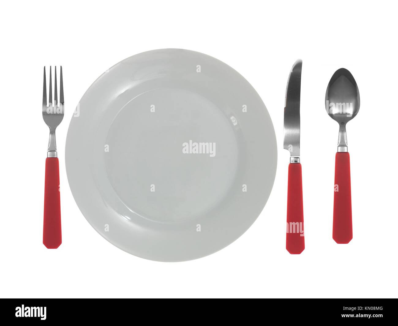 A dinner setting with cutlery and plates Stock Photo Alamy