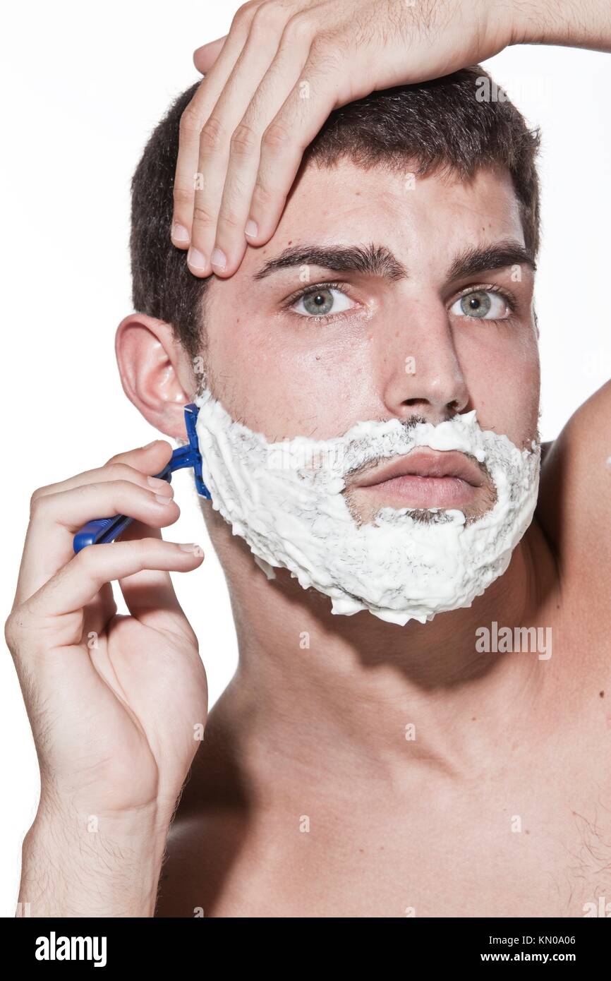 young man shaving Stock Photo Alamy
