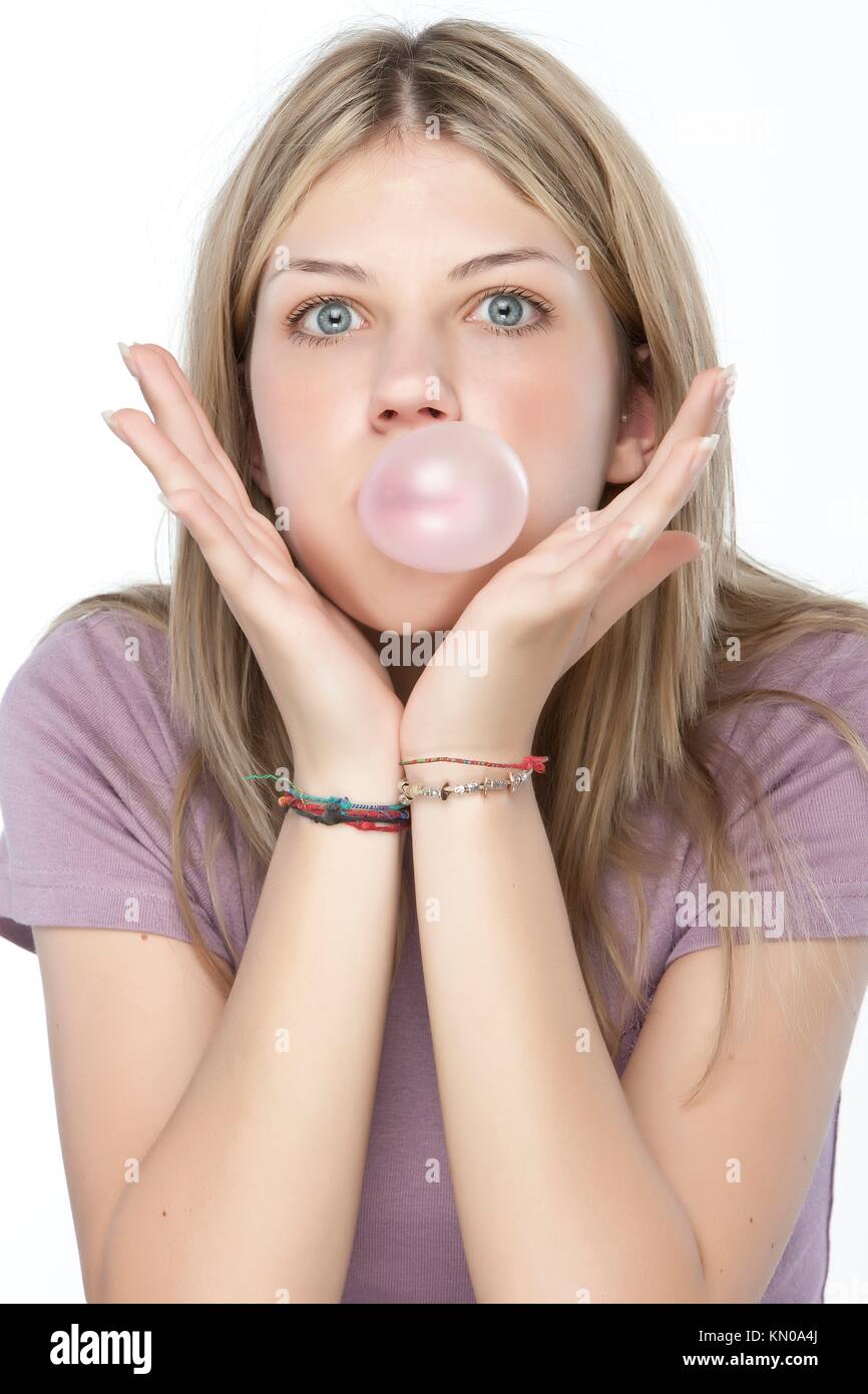 Beautiful girl making a bubble from chewing gum Stock Photo Alamy