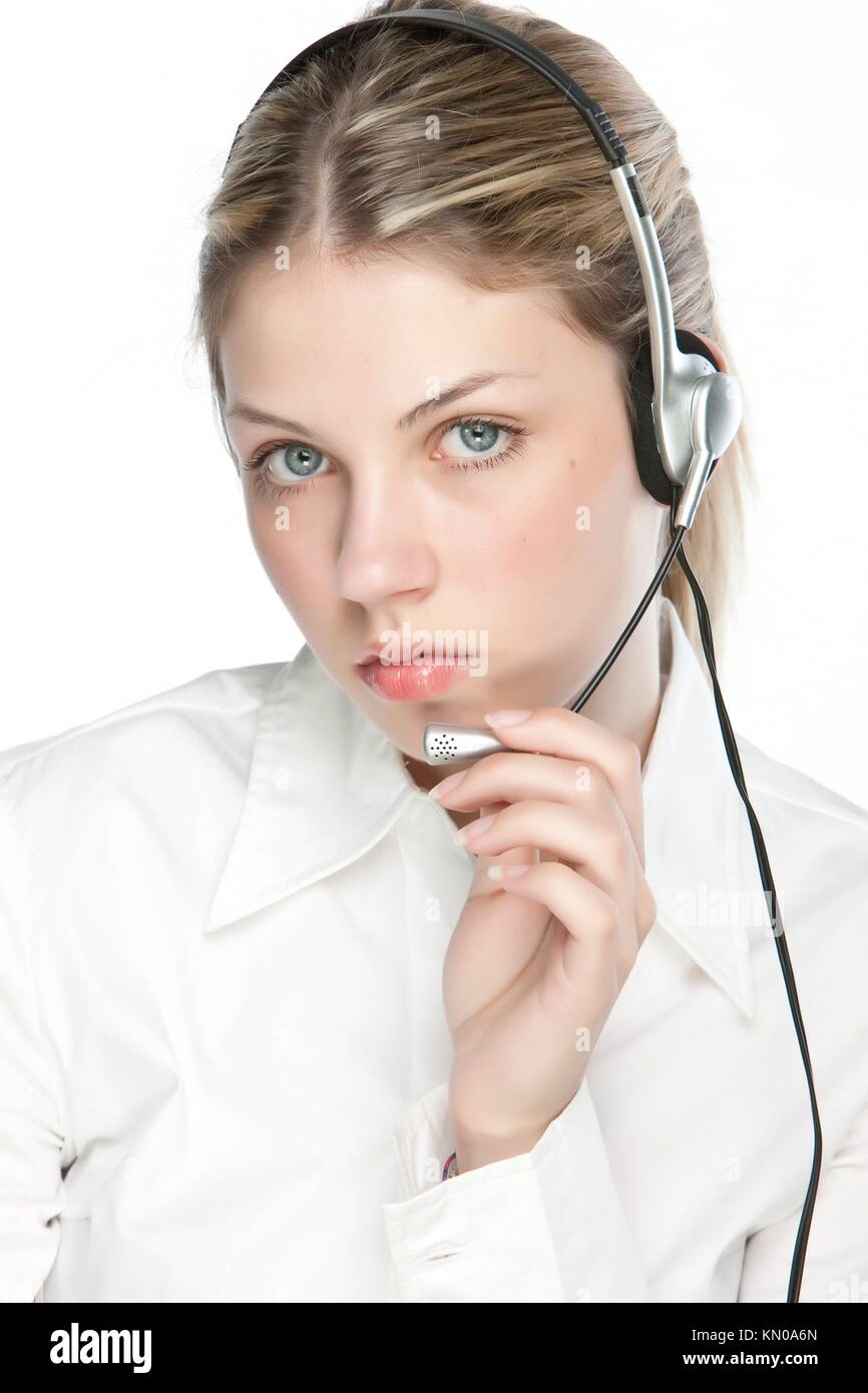 A friendly secretary/telephone operator in an office environment Stock
