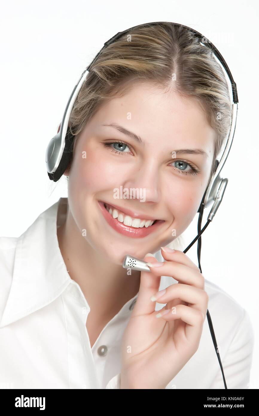 A friendly secretary/telephone operator in an office environment Stock