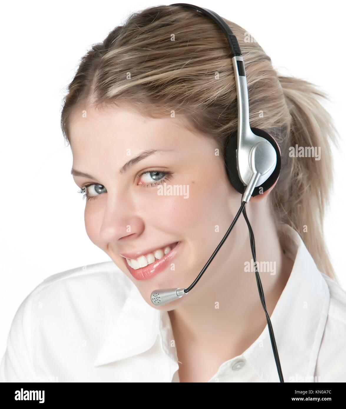 A friendly secretary/telephone operator in an office environment Stock