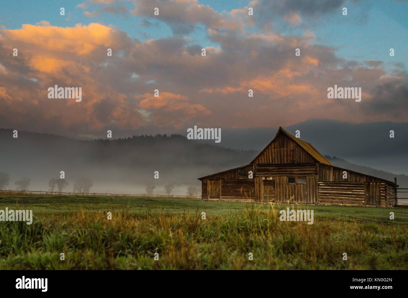 The sun rises over the T. A. Moulton Barn at the Grand Teton National ...