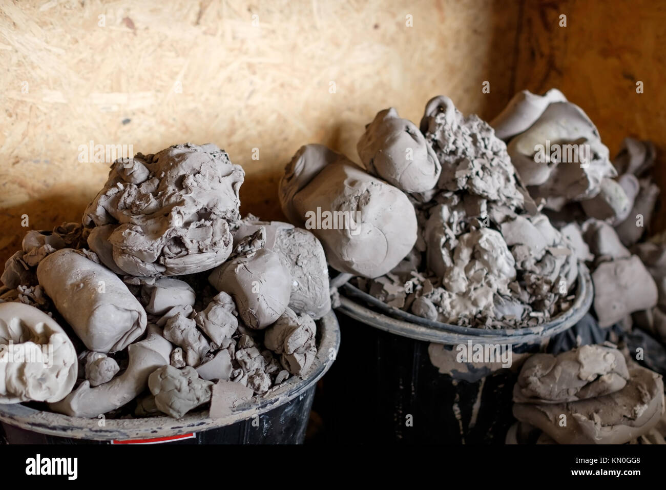 A lot of pieces of gray clay for modeling in basket Stock Photo