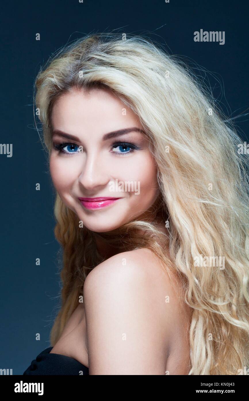 portrait of a young beautiful woman with long blond hair smiling Stock ...