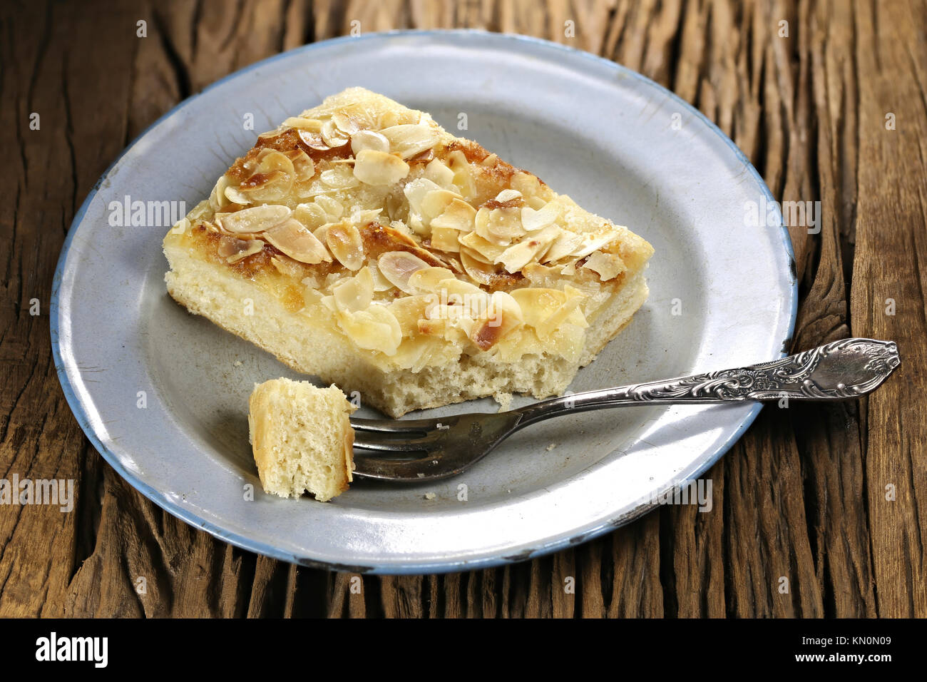 Traditional North German Butterkuchen (butter cake) on old enamel plate Stock Photo Alamy