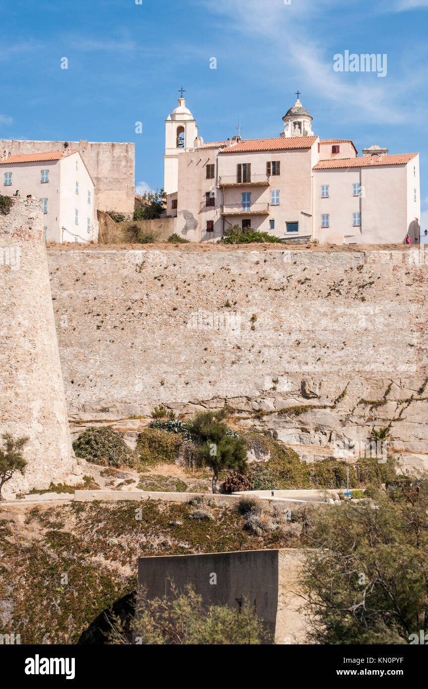 Corsica: skyline of the Citadel of Calvi, famous touristic destination on the northwest coast, with its ancient walls and bell towers of the churches Stock Photo