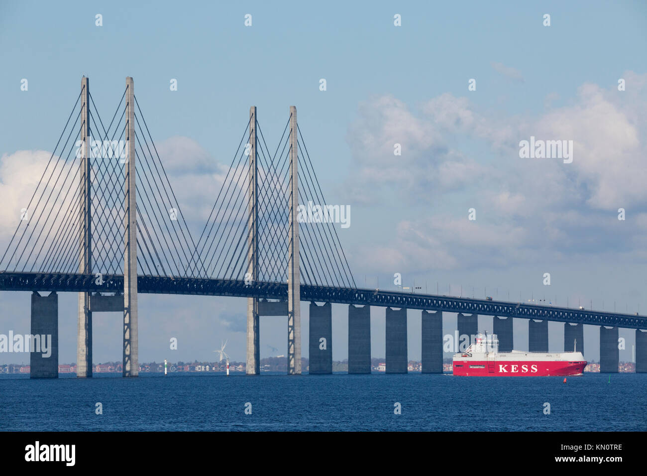 Commercial vessel passes The Øresund Bridge Stock Photo
