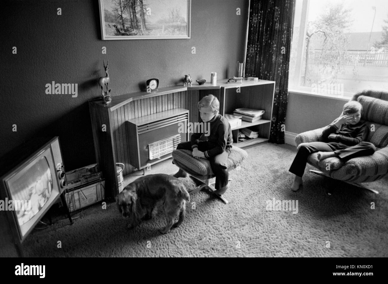Children watching television TV UK 1970s middle class family life at home interior of house. 70s England HOMER SYKES Stock Photo