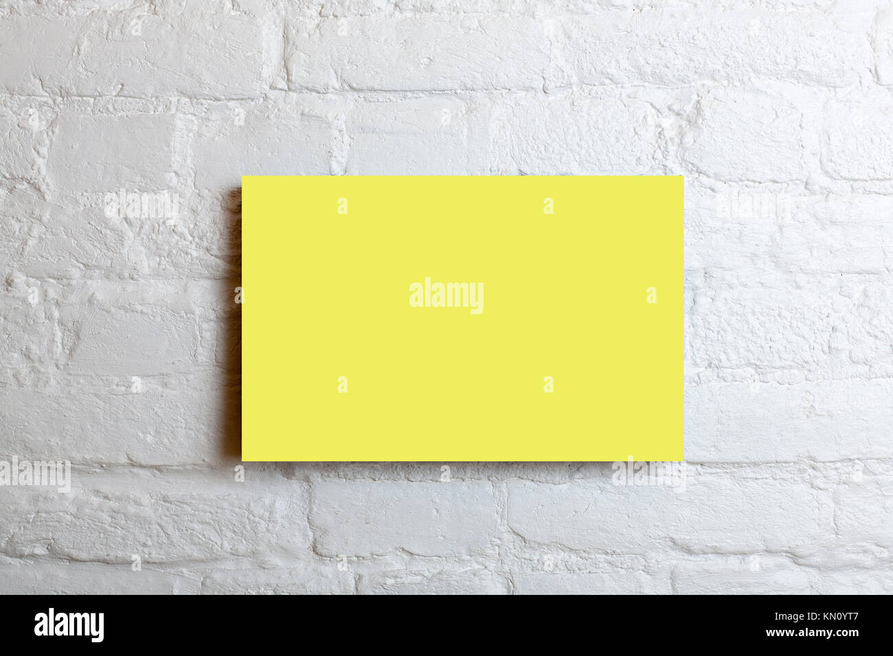 Download Yellow Blank Poster In A White Brick Wall Template Mock Up For Your Stock Photo Alamy PSD Mockup Templates