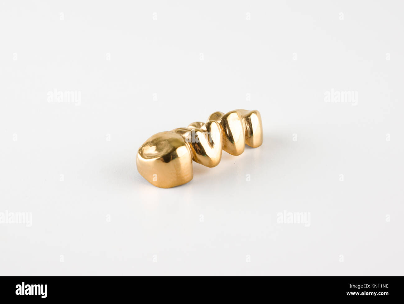 Artificial teeth made of steel with a coating of titanium nitride Stock