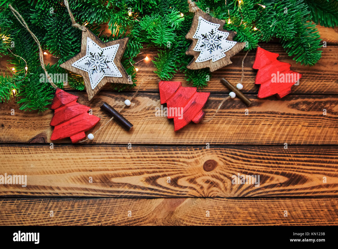 Christmas vintage background. Traditional red Xmas decoration over old wood Stock Photo