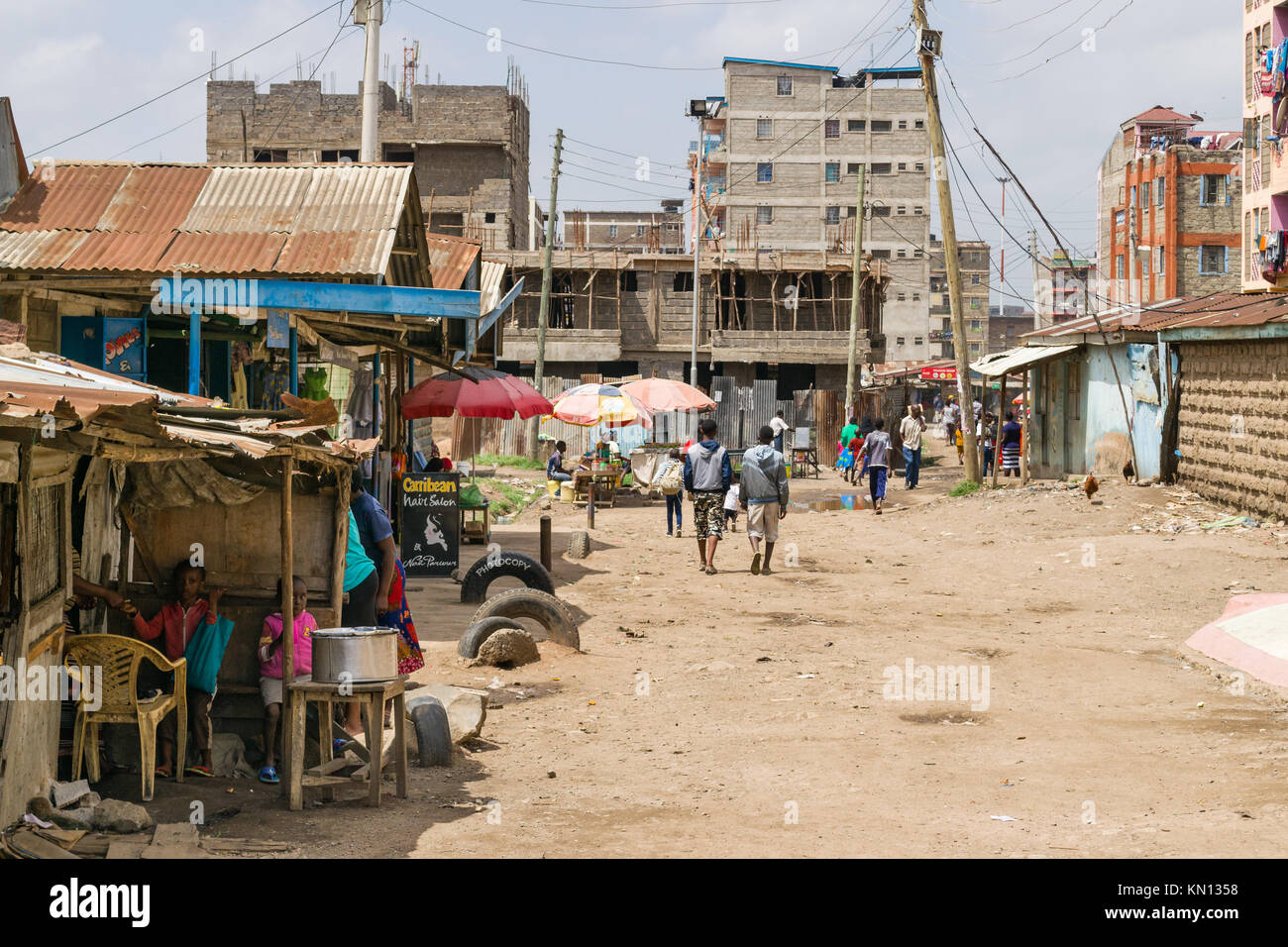 A view of part of the Huruma area of Nairobi with people going about daily life, Nairobi, Kenya, East Africa Stock Photo