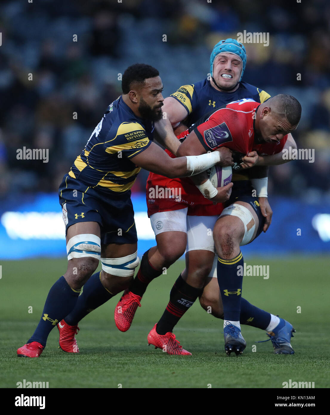 Oyonnax's Hika Elliot is tackled by Worcester's Andrew Durutalo and Pierce Phillips during the European Rugby Challenge Cup, Pool Five match at Sixways Stadium, Worcester. Stock Photo