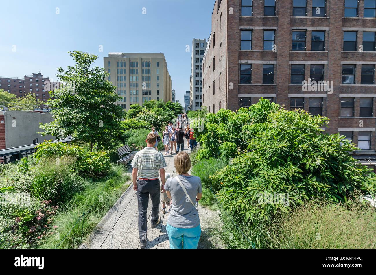 NEW YORK CITY JULY 22 People walk along the High Line Park on July