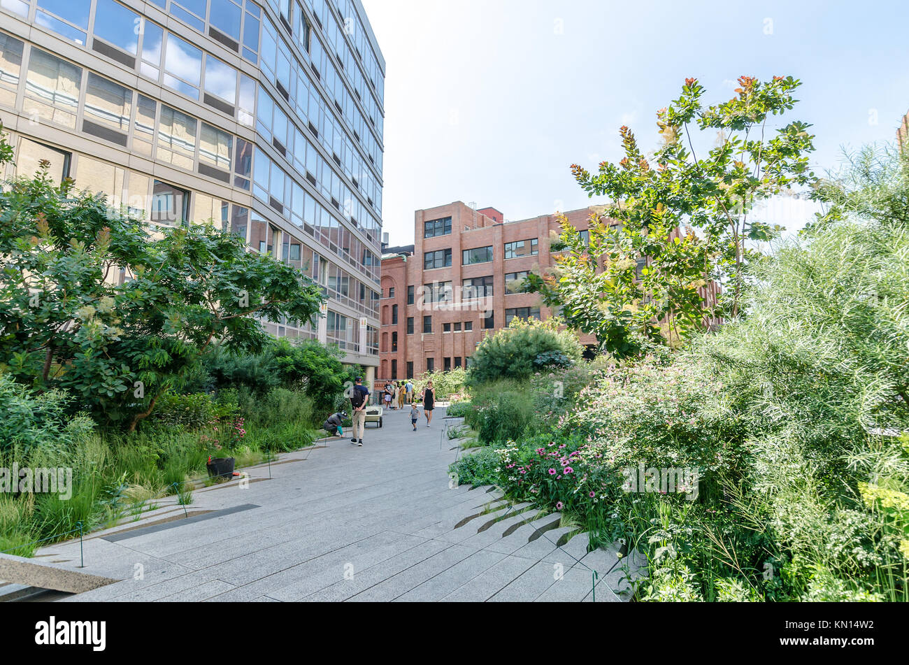NEW YORK CITY - JULY 22: People walk along the High Line Park on July ...