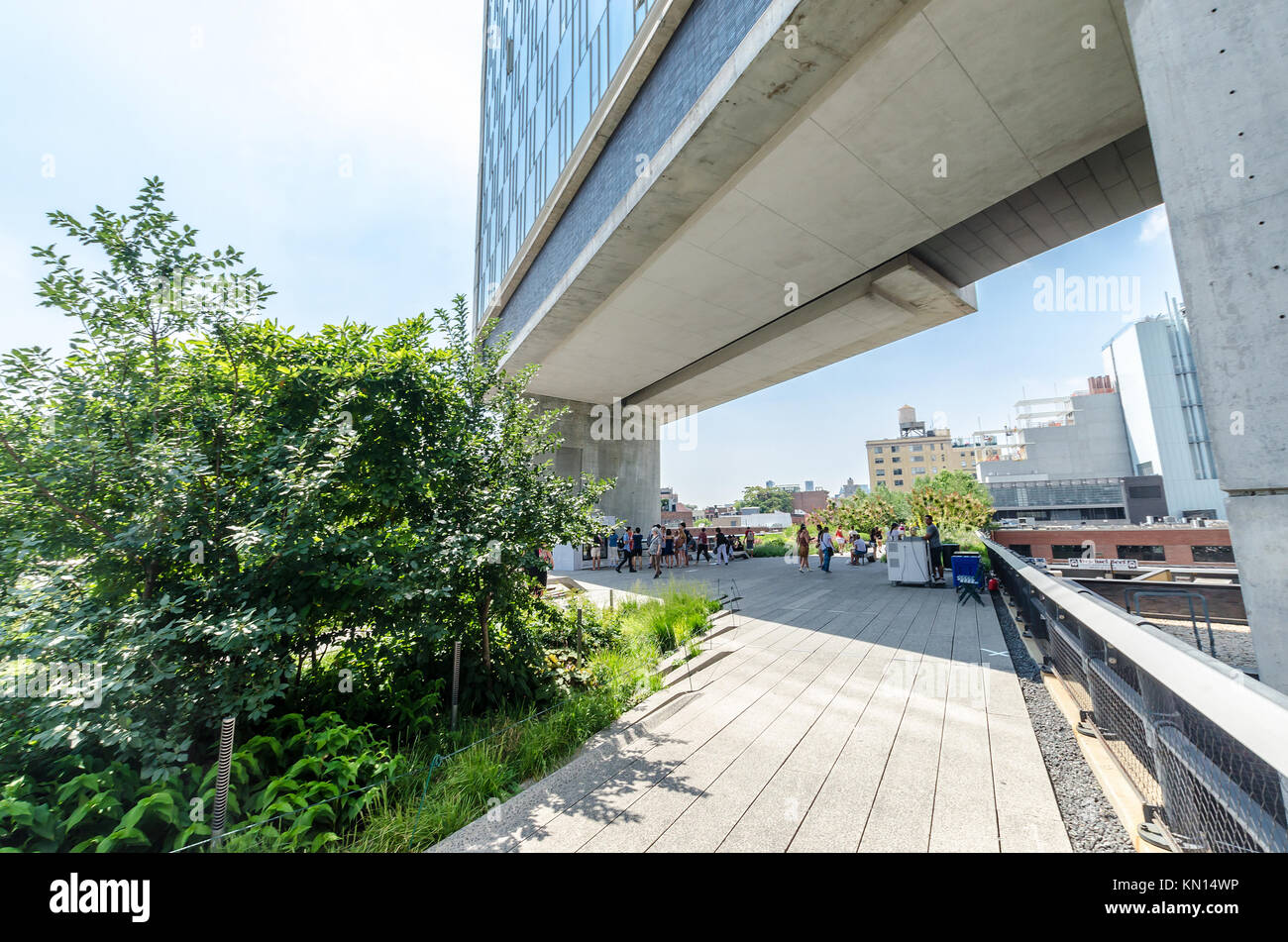 NEW YORK CITY - JULY 22: People walk along the High Line Park on July ...
