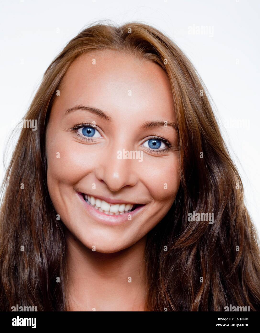 portrait of a young beautiful woman with brown hair and blue eyes ...
