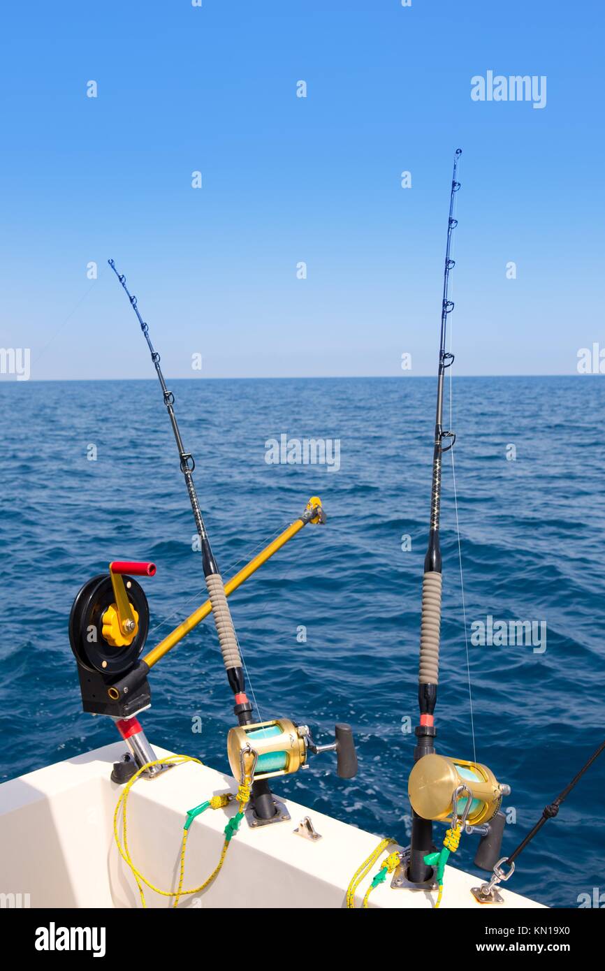 boat trolling fishing gear downrigger and two rods with golden reels Stock  Photo - Alamy
