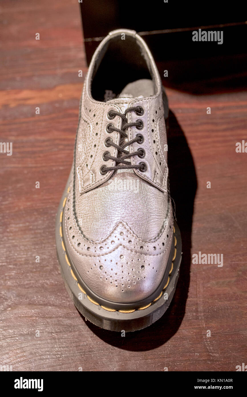 Men's silver wingtip shoes for sale at the Doc Martens franchise store Broadway in lower New York City Stock Photo - Alamy