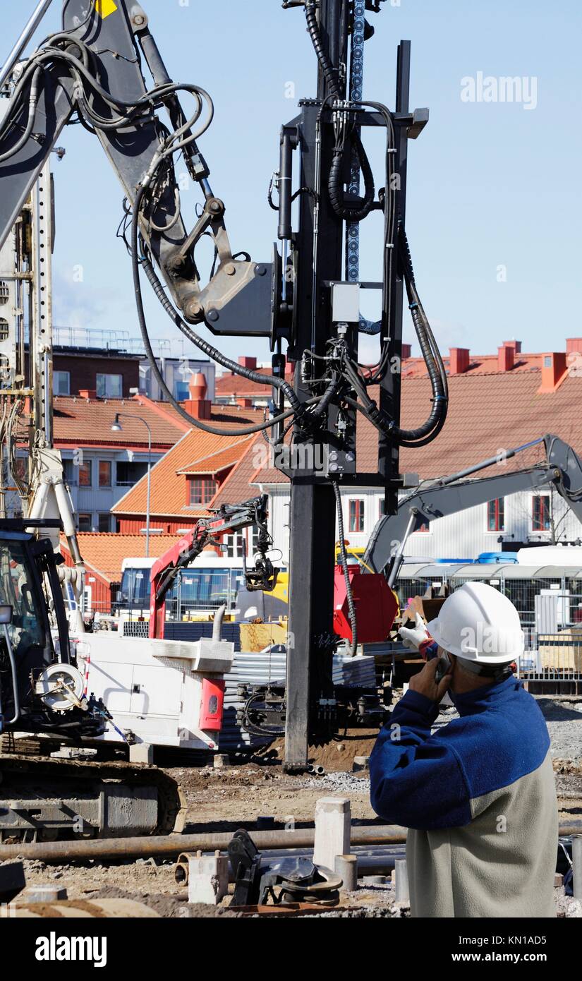 engineer with heavy building machinery, construction. Stockholm. sweden