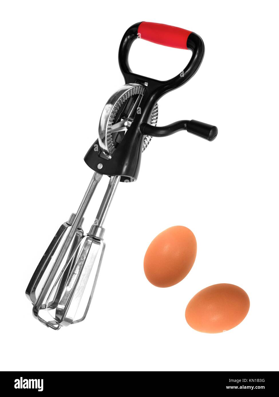 Egg beaters isolated against a white background Stock Photo Alamy