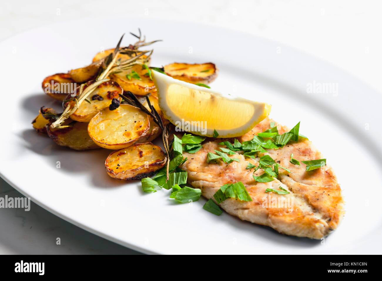 Grilled Mackerel With Roasted Potatoes Stock Photo - Alamy