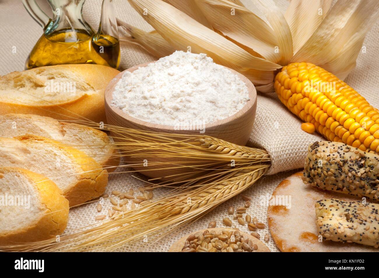 still life of bread and wheat flour, corn and oats Stock Photo Alamy