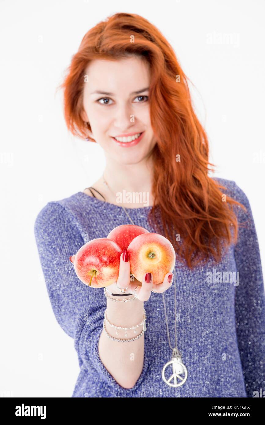 Beautiful woman holding fresh apples. Stock Photo