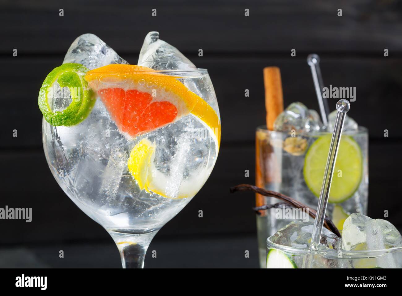 Gin tonic varied cocktails with lima lemon and grapefruit vanilla and cinnamon spices Stock