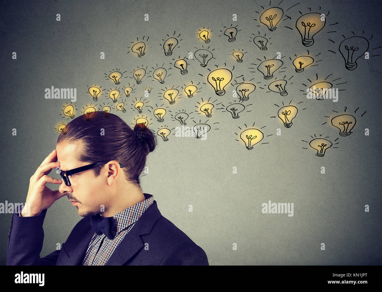 Man wearing nerdy glasses having many ideas thinking organizing thoughts Stock Photo
