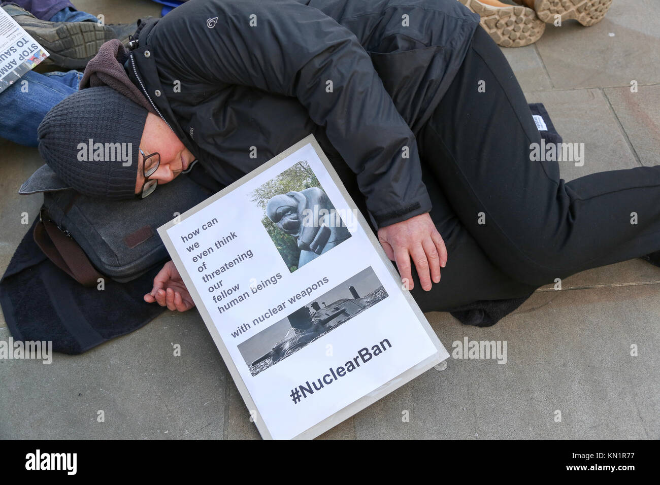 London, UK. 09th Dec, 2017. 9th Dec, 2017. ICAN UK, Medact and CND hold a die-in outside the Ministry of Defence, London, to draw attention to the indiscriminate nature of nuclear weapons. Penelope Barritt/Alamy Live News Credit: Penelope Barritt/Alamy Live News Stock Photo