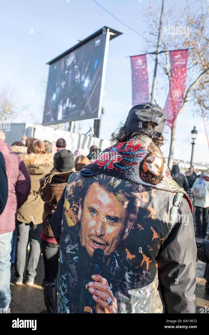 Popular commemoration of the death of French singer Johnny Hallyday in Paris: a fafan with a johnny hallyday's flocked jacket Stock Photo