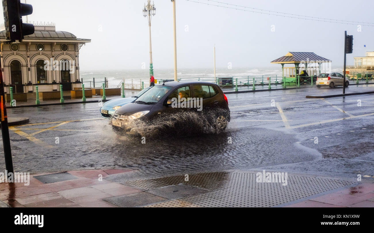 Brighton, UK. 10th Dec, 2017. Surface water on the seafront road in Brighton this morning as high winds and rain battered the south coast . Many parts of Britain are being hit by heavy snow falls today and more is forecast over the next few days Credit: Simon Dack/Alamy Live News Stock Photo