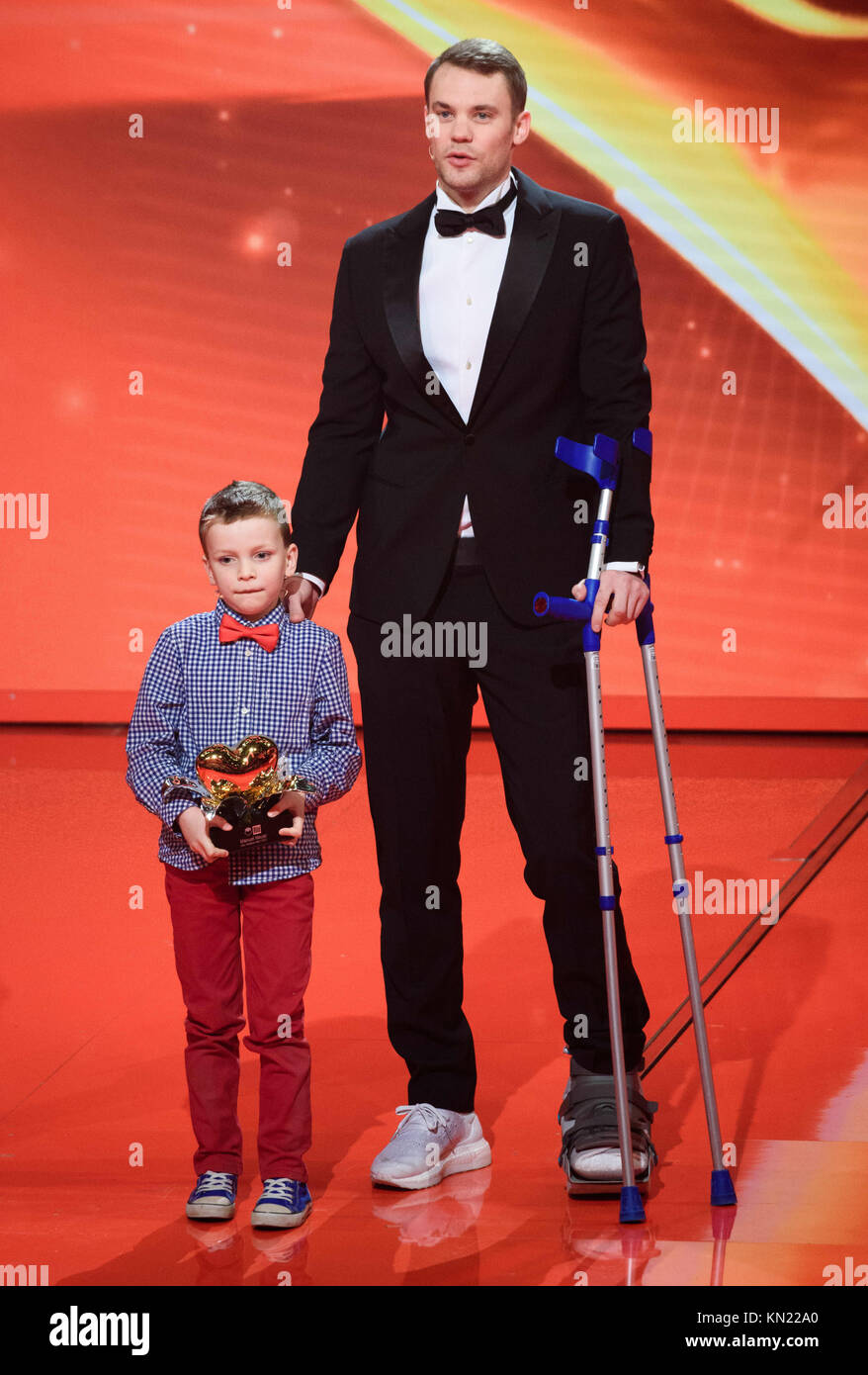 Berlin, Germany. 09th Dec, 2017. Frederik (C) awarding soccer player Manuel  Neuer (R) from FC Bayern Munich with the Golden Heart during the charity  gala "A heart for children" in Berlin, Germany,