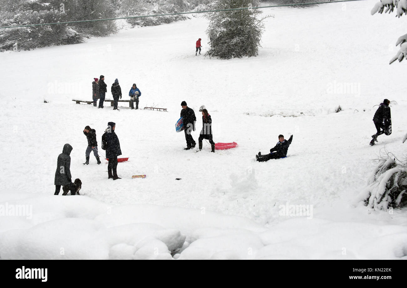 Winter scene Britain Uk families sledging on The Lodge Field, Ironbridge 2017 people children snow Families having fun in the snow on The Lodge Field after 10 inches of snow  settled thies weekend. Credit: David Bagnall/Alamy Live News Stock Photo