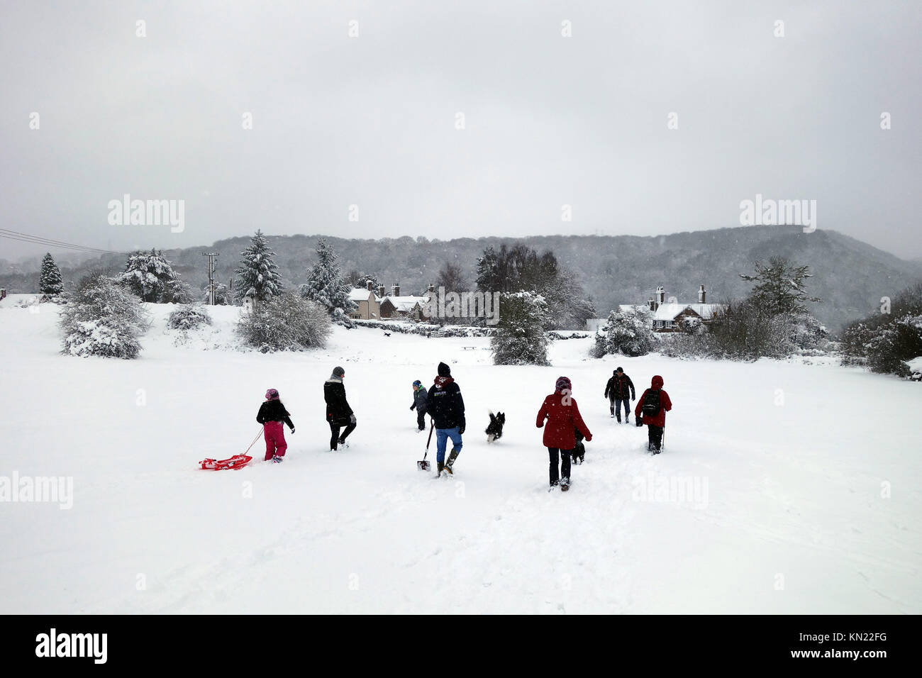 Winter scene Britain Uk families sledging on The Lodge Field, Ironbridge 2017 people children snow Families having fun in the snow on The Lodge Field after 10 inches of snow settled this weekend. Credit: David Bagnall/Alamy Live News Stock Photo