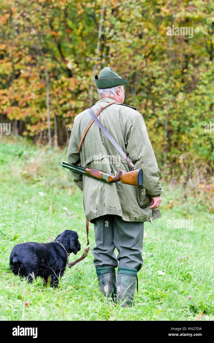 hunter with his dog hunting Stock Photo Alamy