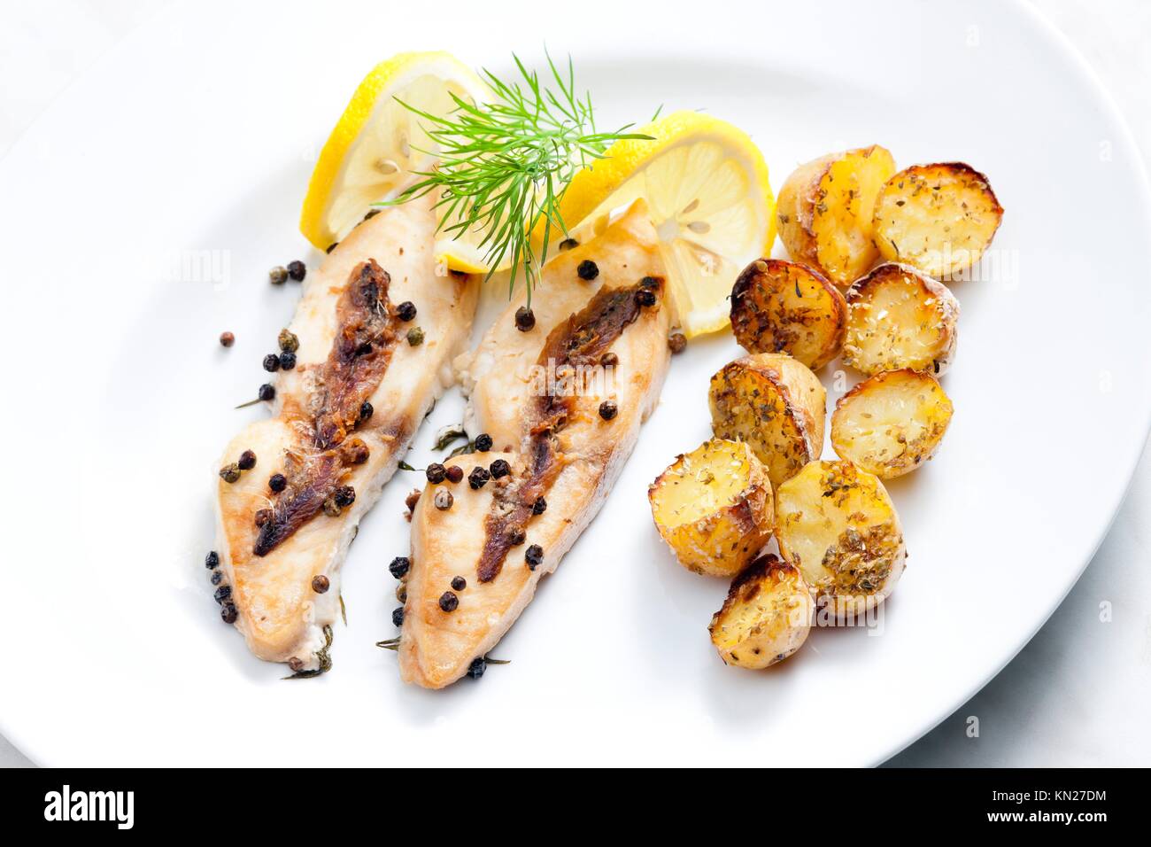 butterfish baked on pepper and anchovies Stock Photo - Alamy