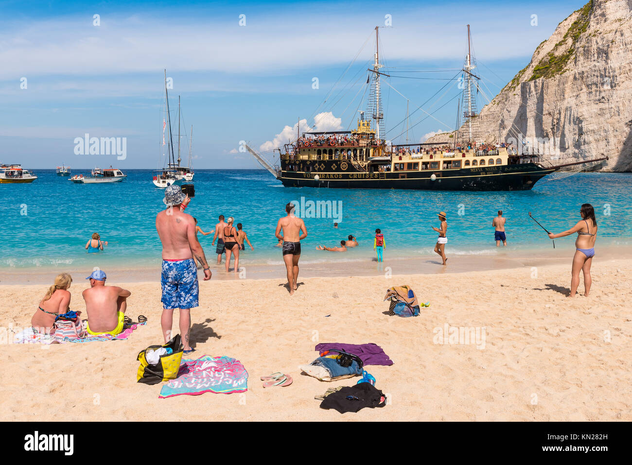 ZAKYNTHOS, GREECE, September 27, 2017: Tourists enjoying a summer day on Navagio beach in Greece. Zakynthos island. Stock Photo